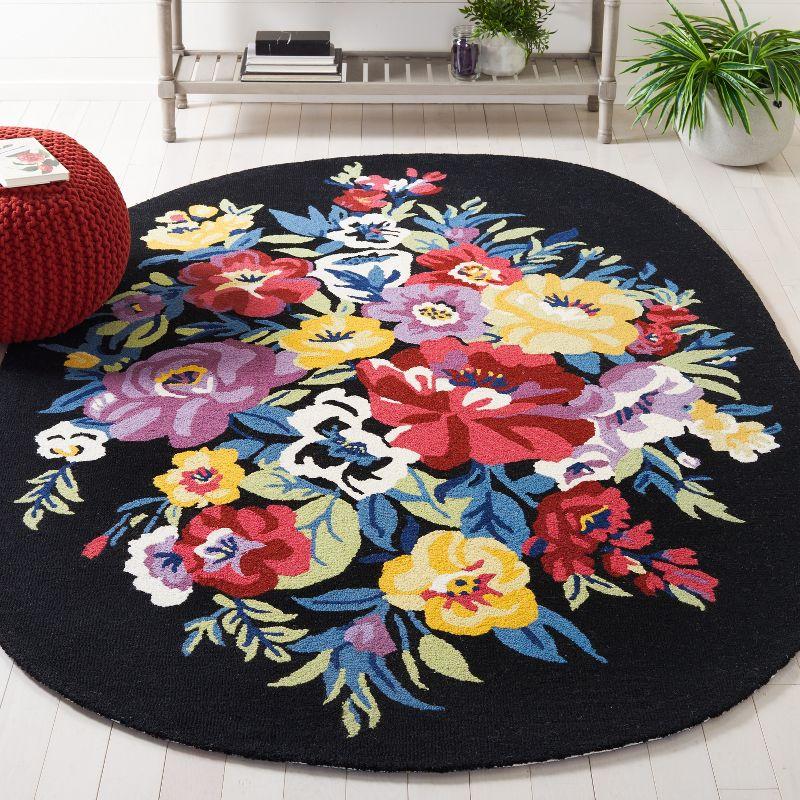 Handmade Chelsea Floral Black Wool Oval Rug - 4' x 6'