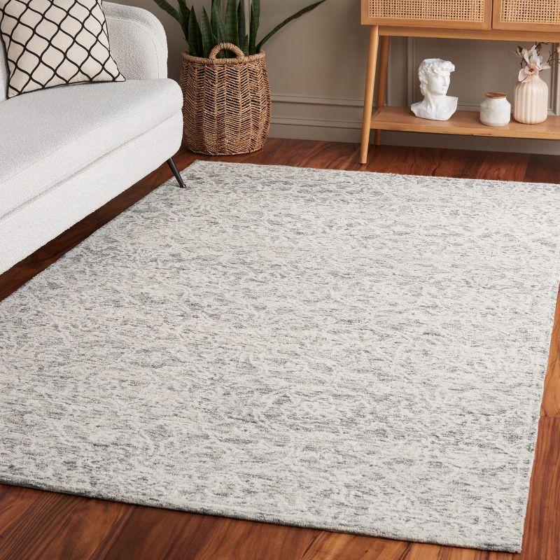 Ivory Tufted Handmade Wool 6' x 9' Area Rug