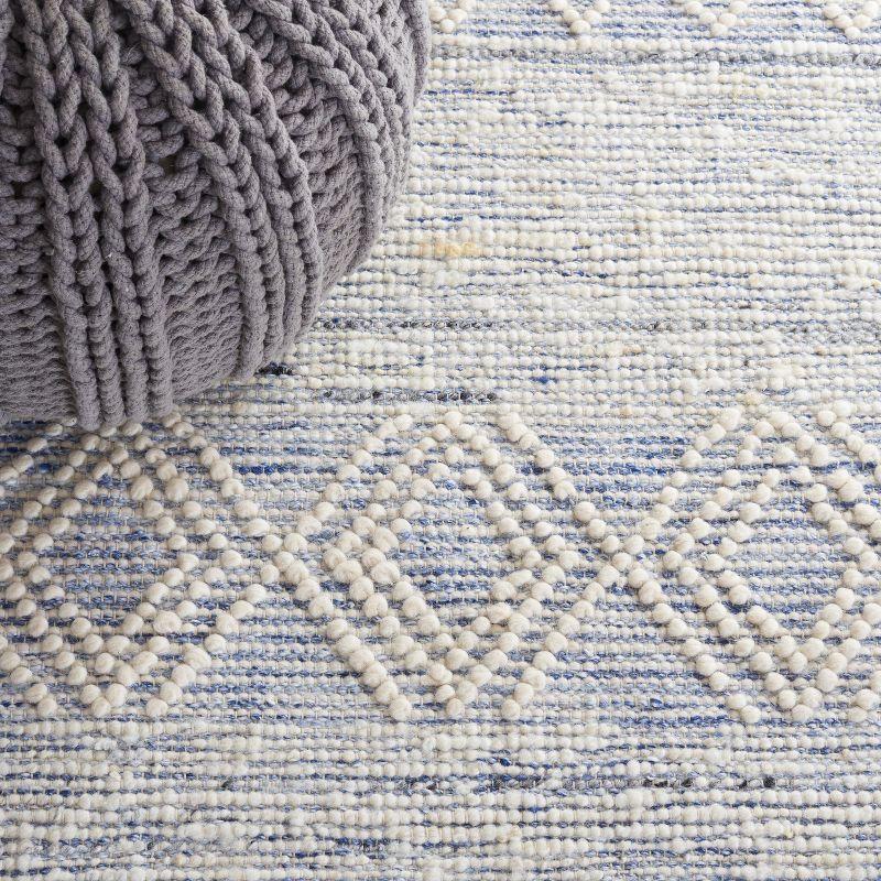 Ivory and Blue Handwoven Wool Area Rug with Fringe