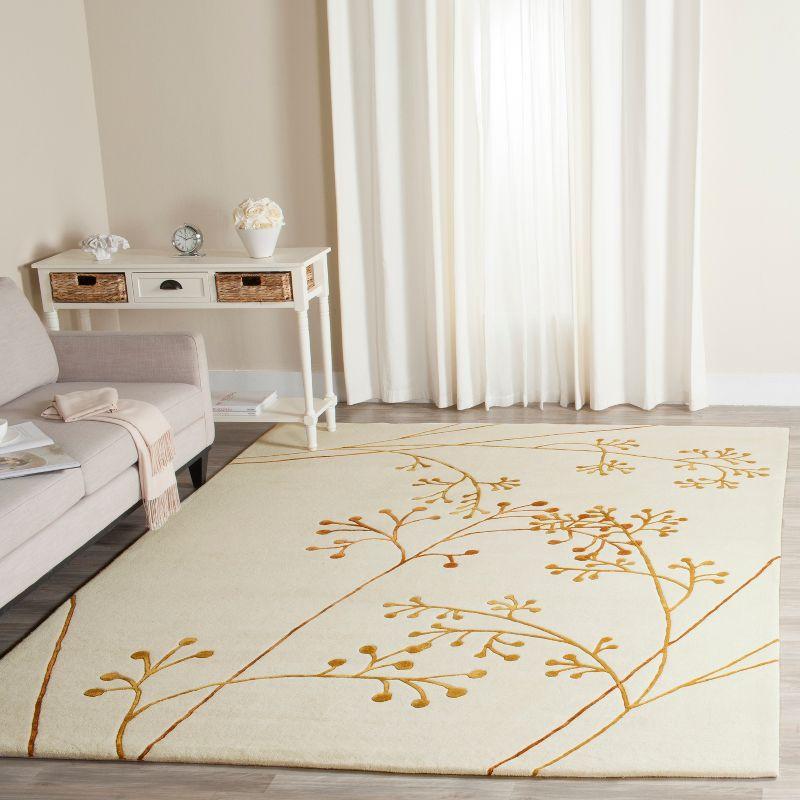 Soho SOH305 Hand Tufted Area Rug - Ivory/Orange - 7'6"x9'6" - Safavieh.