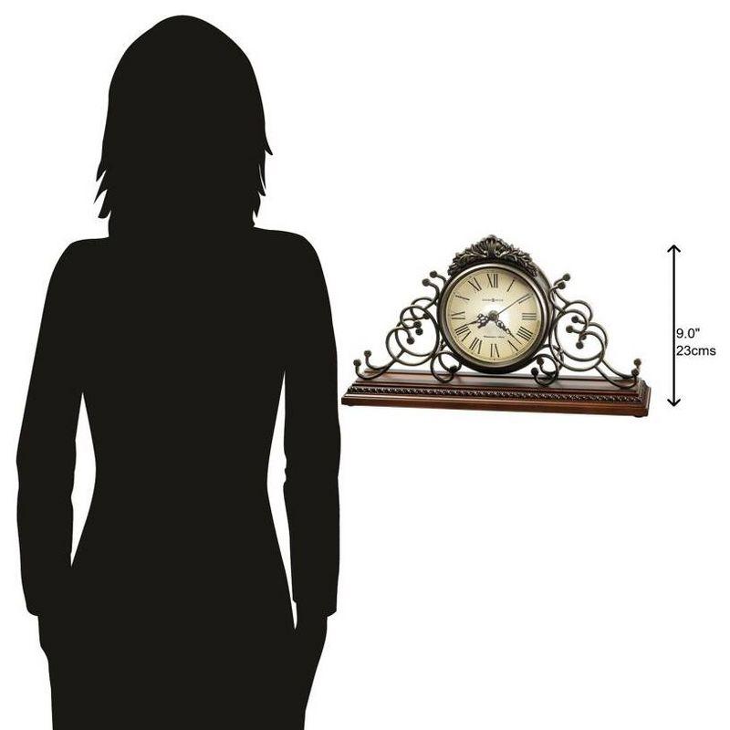 Howard Miller® Adelaide Traditional Roman Numeral Metal Quartz Movement / Crystal Tabletop Clock in Antique Warm-Gray/Windsor Cherry