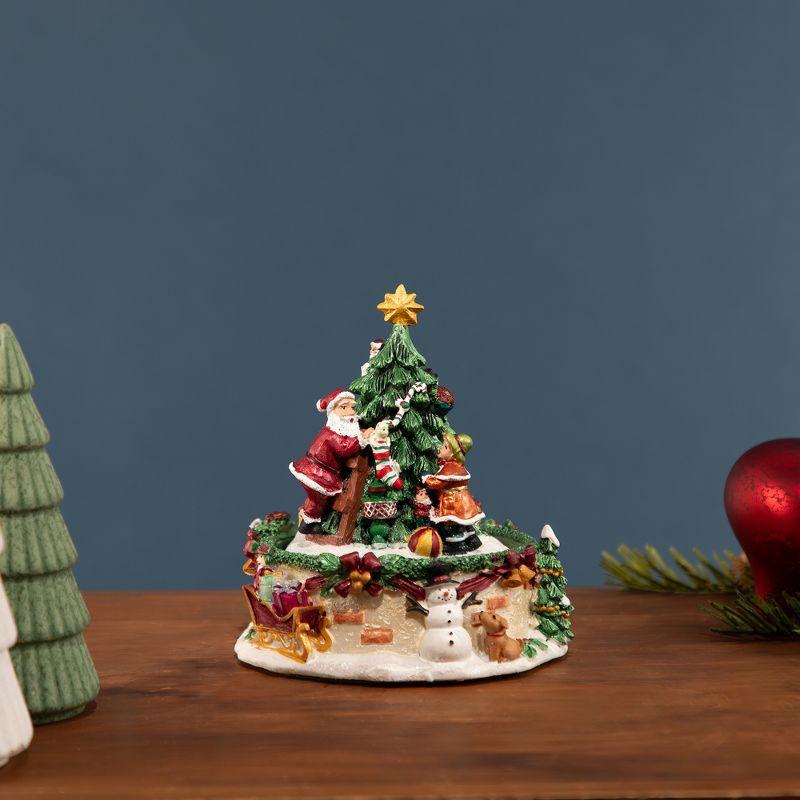 Northlight Seasonal 5.5" Musical Santa Claus and Christmas Tree Winter Scene Rotating Tabletop Decoration