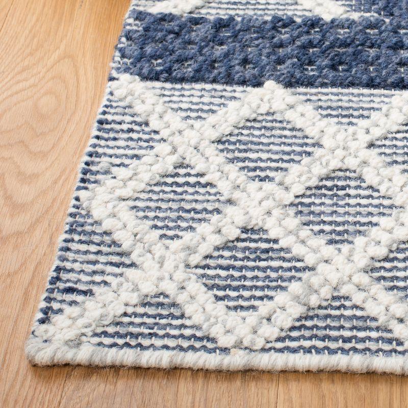 Ivory and Blue Handwoven Wool 6' x 9' Area Rug