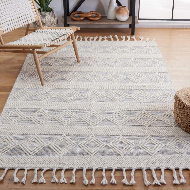 Ivory and Beige Handwoven Wool Area Rug with Fringe