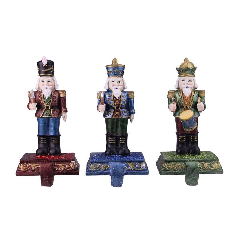 Glittered Nutcracker Stocking Holders Set of Three in Red, Blue, and Green