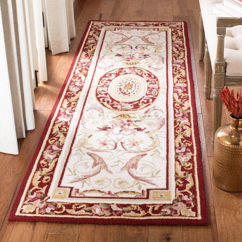 Elegant Ivory and Burgundy Hand-Knotted Wool Runner Rug