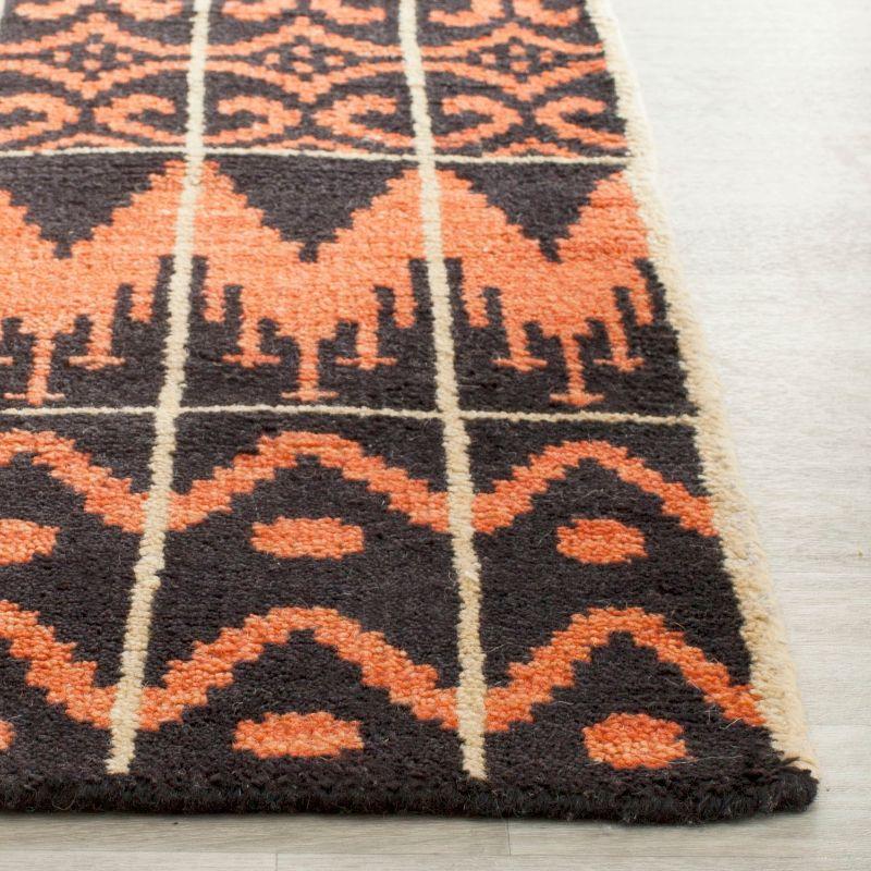Union Rustic Alimatou Hand Knotted Wool/Cotton Southwestern Rug in Orange/Black