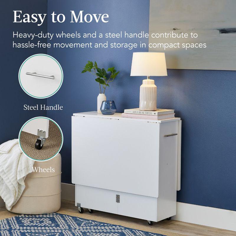 Best Choice Products Multipurpose Folding Table w/ Wheels, 3 Storage Shelves, Cubby, Handle - White
