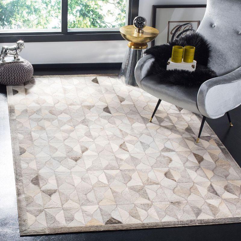 Ivory Geometric Hand-Knotted Cowhide Area Rug