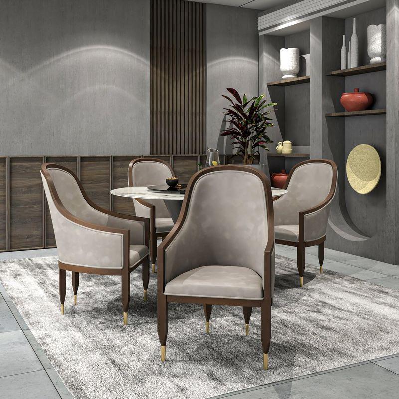 Everly Quinn Jacinto Dining Chair Upholstered In Leather With Rubberwood Frame And Legs With Gold Caps