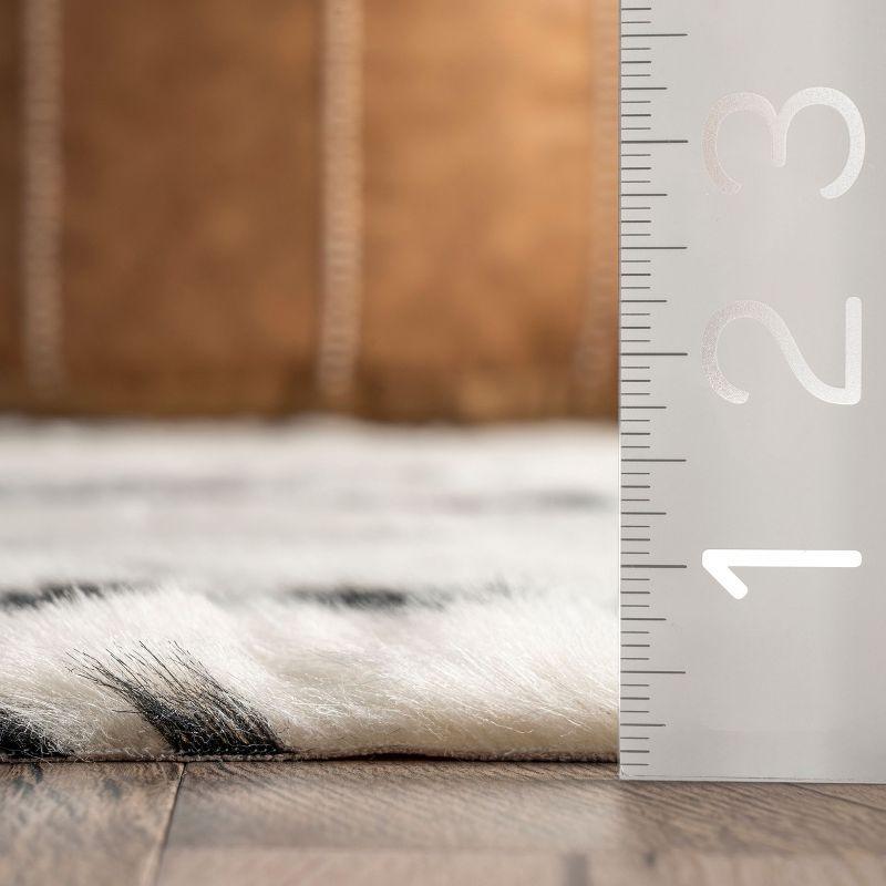 Nuloom Marcia SpinClean Machine Washable Faux Cowhide Area Rug, Shaped 3' 10" x 5', Black