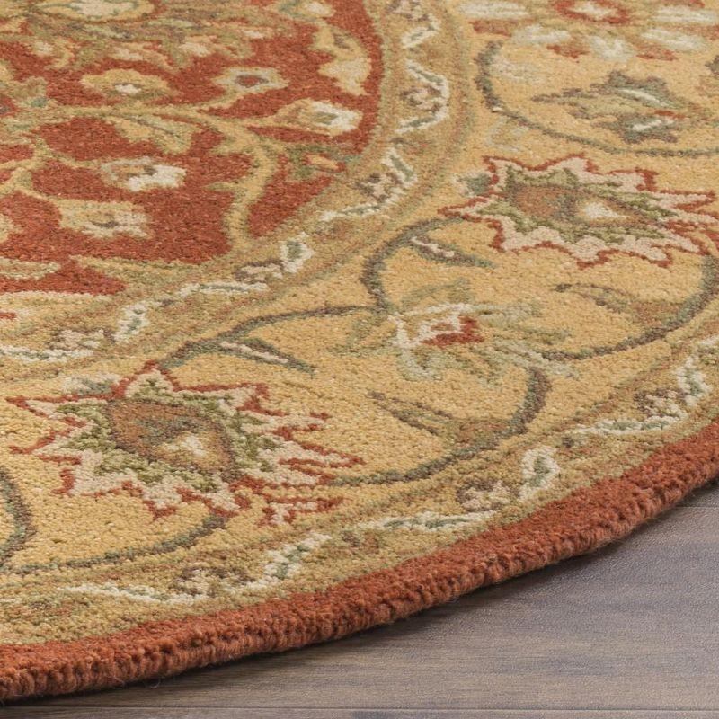 Handmade Rust and Gold Wool Oval Area Rug