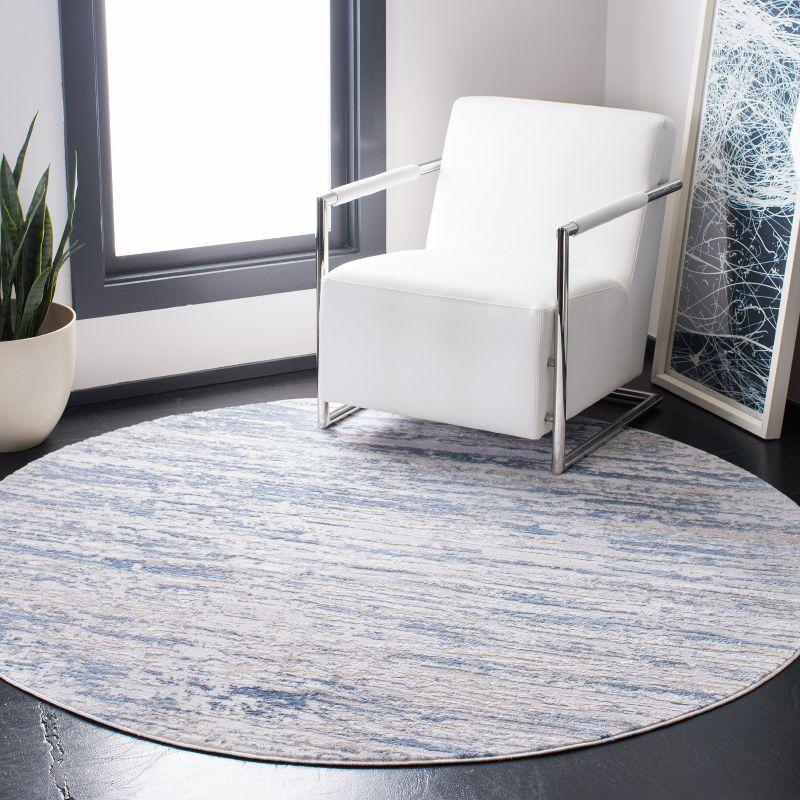 Amelia Ivory and Blue Round Synthetic Area Rug