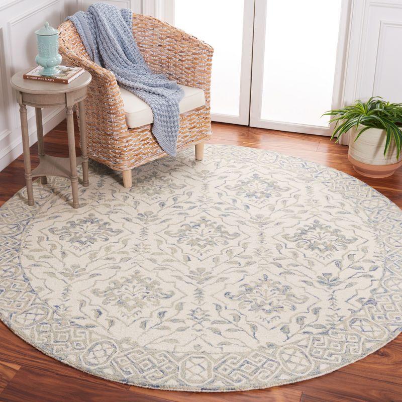 Handmade Light Blue and Ivory Round Wool Area Rug