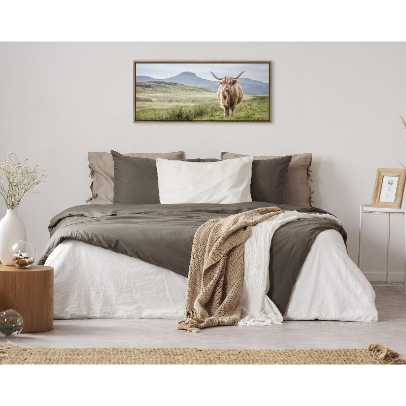 Kate and Laurel Sylvie Highland Cow Mountain Landscape Framed Canvas by The Creative Bunch Studio