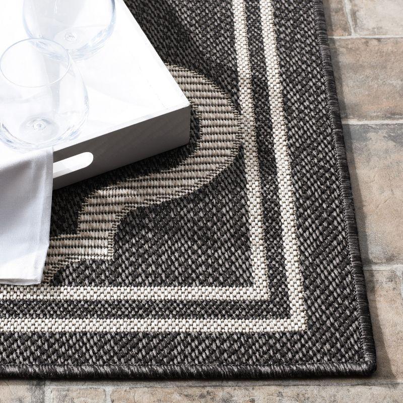 Charcoal and Ivory Geometric Synthetic 5'3" x 7'6" Area Rug