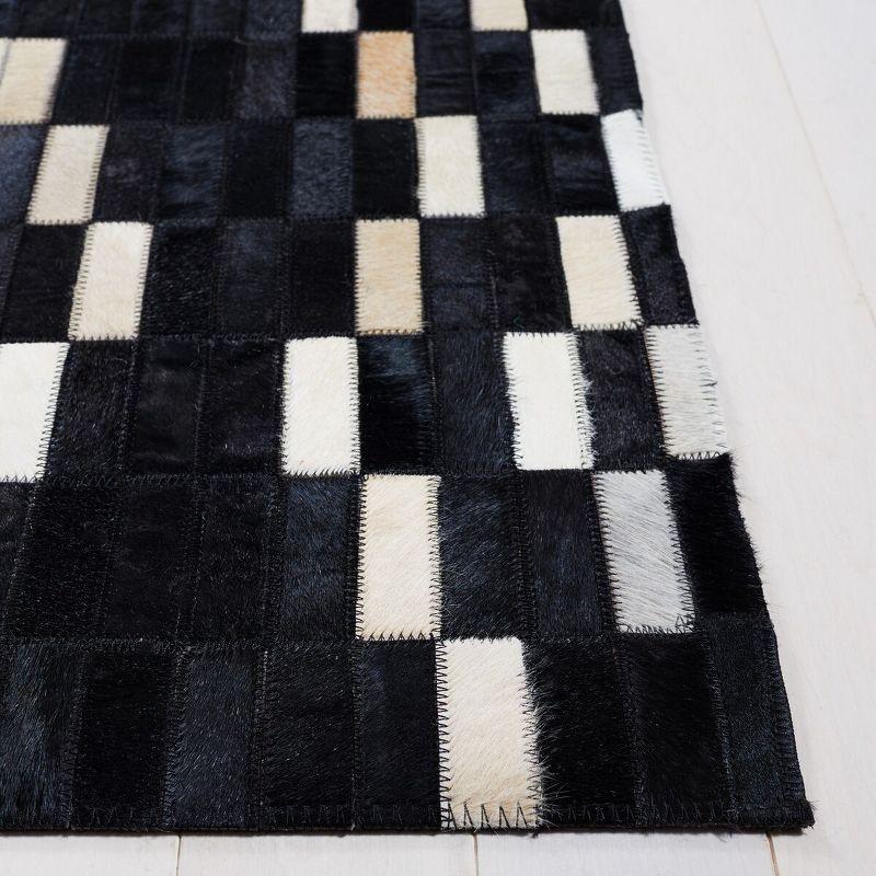 Hand-Stitched Geometric Black Cowhide 4' x 6' Area Rug