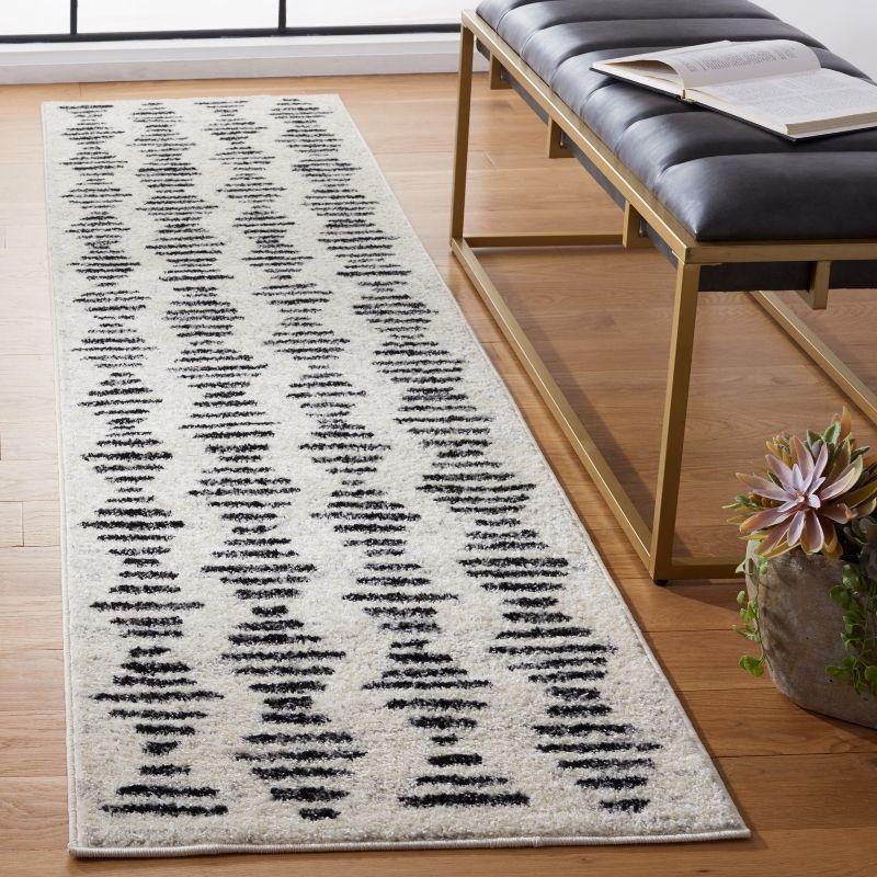 Ivory and Black Geometric Synthetic Runner Rug, 2'2" x 9'