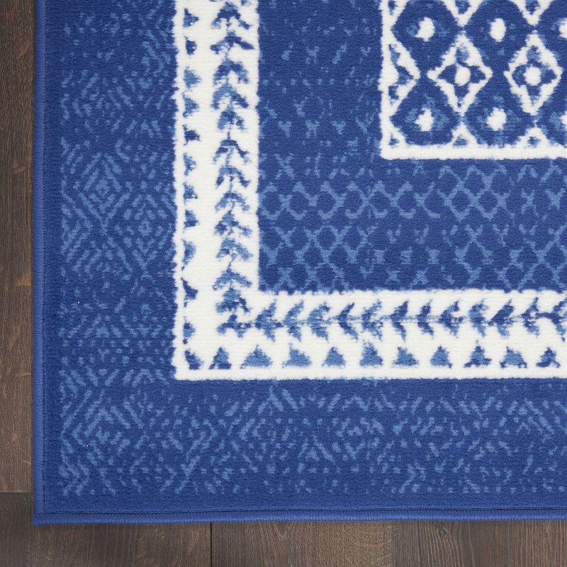 Navy and Ivory Geometric Bohemian 5' x 7' Area Rug