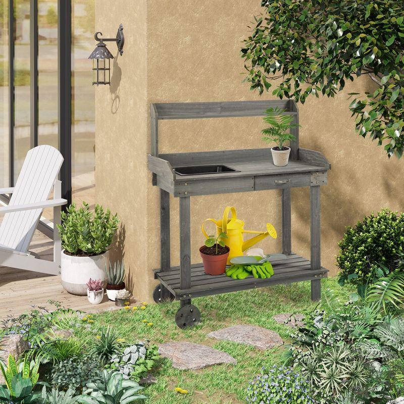 Outsunny Garden Potting Bench Table, Outdoor Wooden Workstation with 2 Removable Wheels, Sink, Drawer & Large Storage Space