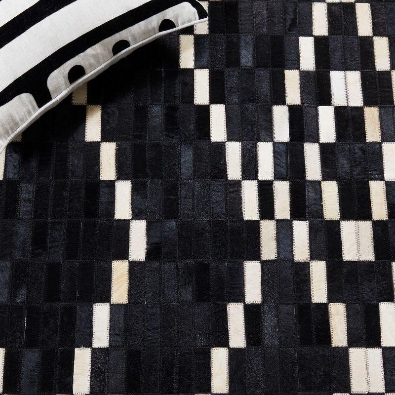 Hand-Stitched Geometric Black Cowhide 4' x 6' Area Rug