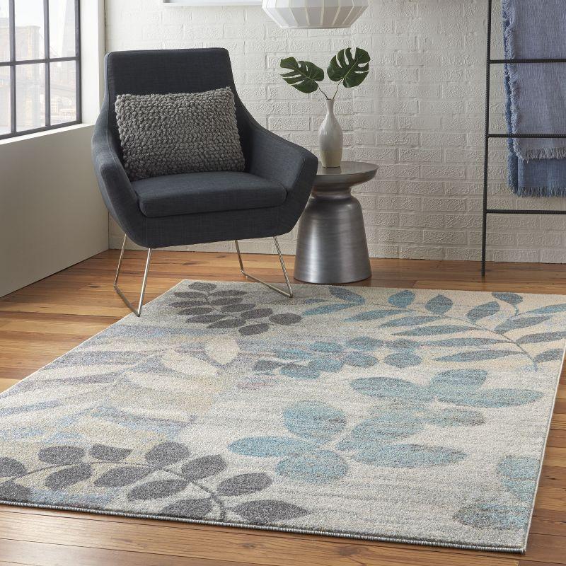 Ivory and Light Blue Floral Synthetic 6' x 9' Area Rug