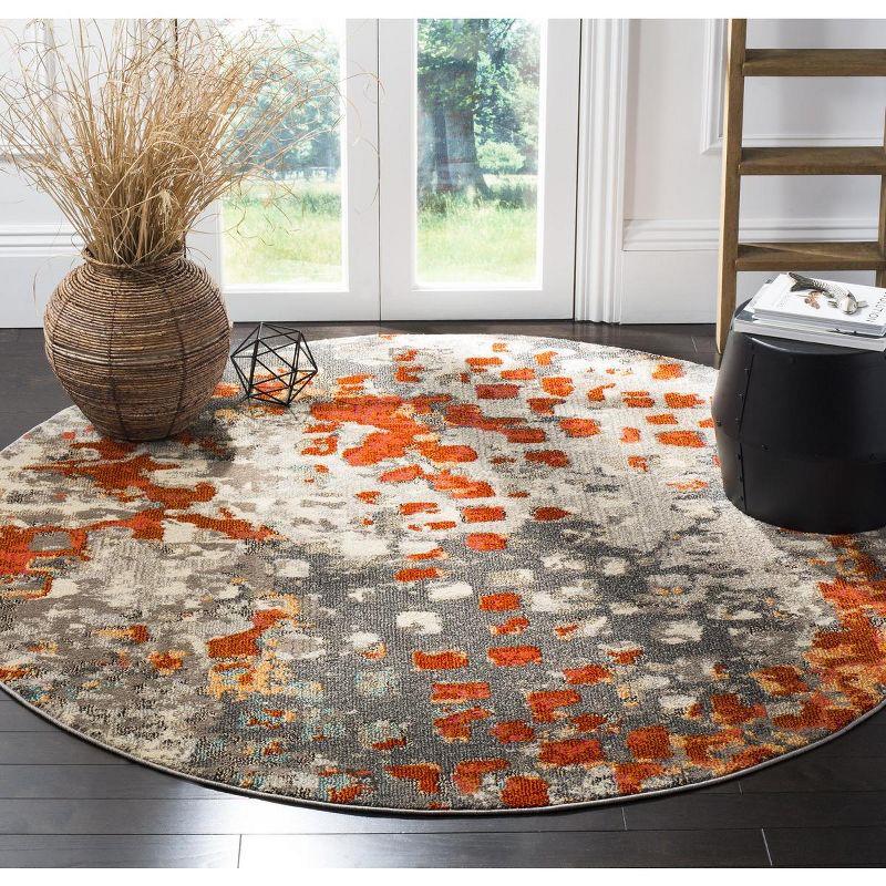 9' Round Grey and Orange Geometric Synthetic Area Rug