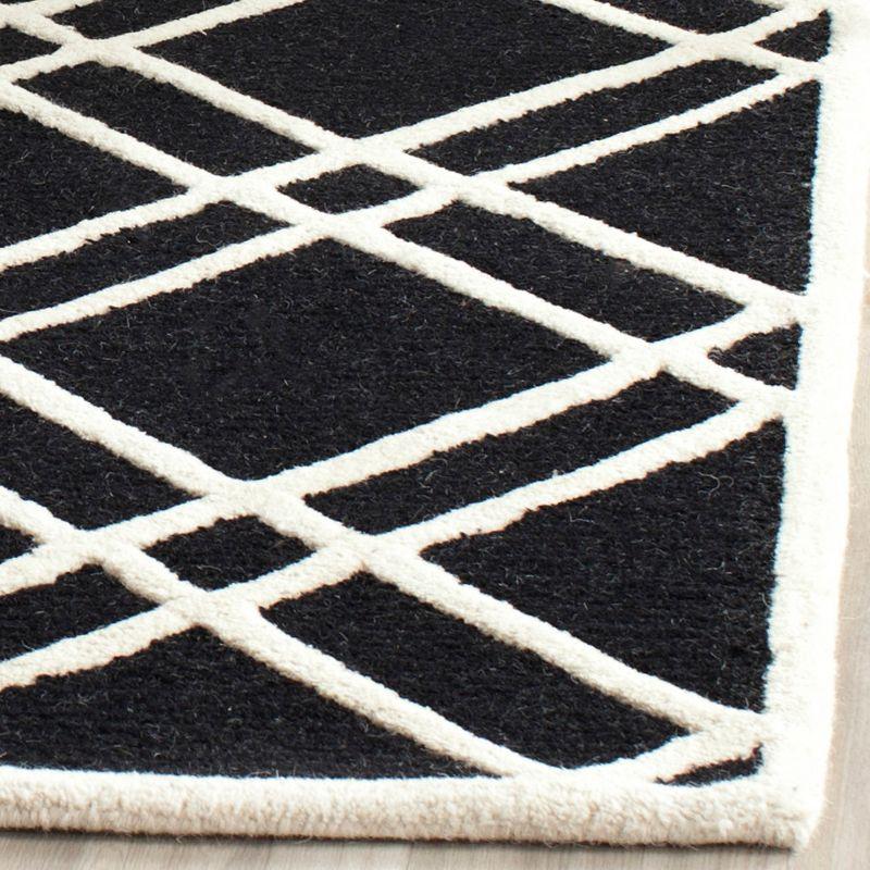 Deedgra Geometric Handmade Tufted Wool Black/White Area Rug