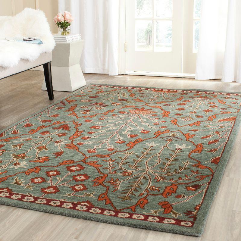 Wyndham WYD206 Hand Tufted Area Rug - Blue/Rust - 5'x8' - Safavieh.
