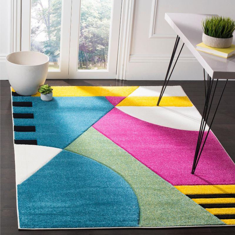 Hollywood HLW706 Power Loomed Area Rug - Peacock Blue/Fuchsia - 5'3"x7'6" - Safavieh.