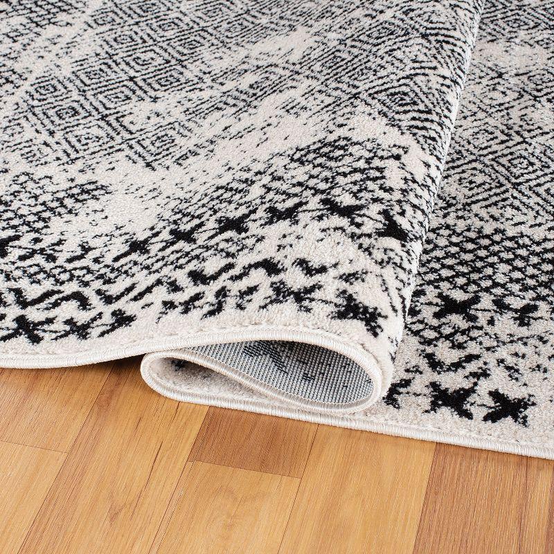 Black Geometric 5' x 7' Synthetic Easy Care Area Rug