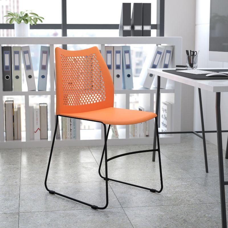 Hercules Series 661 lb Orange Plastic Air-Vent Stack Chair