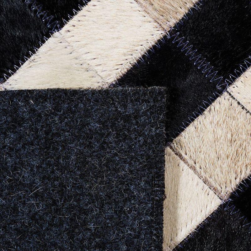 Handmade Black and Ivory Geometric Cowhide Area Rug