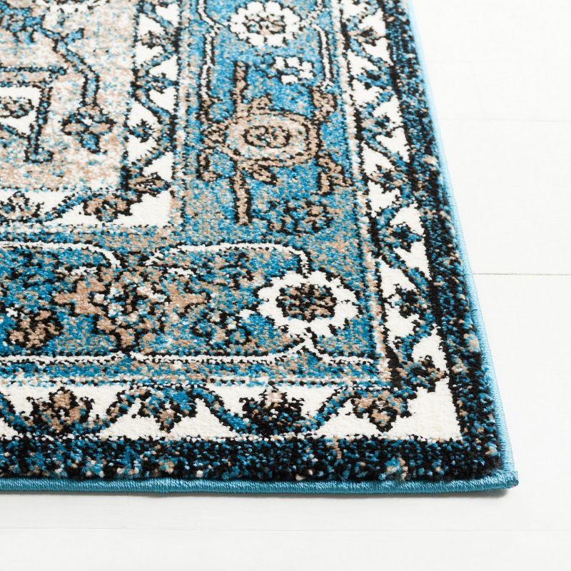 Vintage Blue and Ivory Synthetic 8' x 10' Hand-Knotted Area Rug