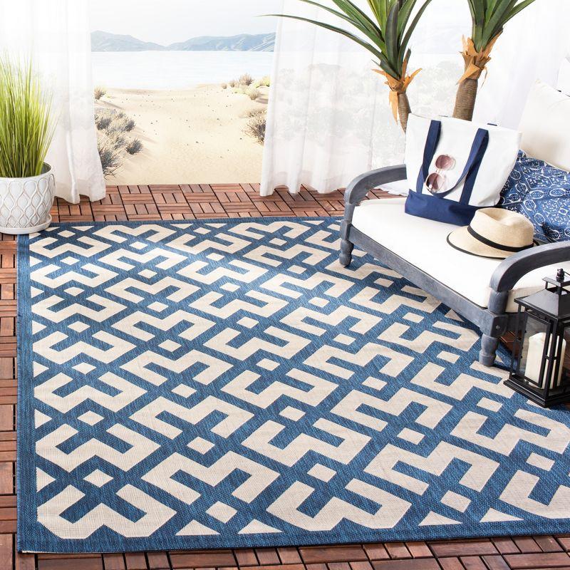 Navy and Beige 5' x 7' Reversible Flat Woven Synthetic Area Rug