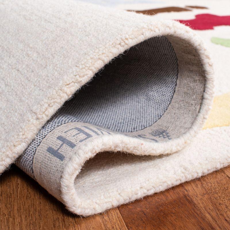 Safavieh Kids SFK389 Hand Tufted Indoor Area Rug - Ivory/Multi - 5'x8' - Safavieh
