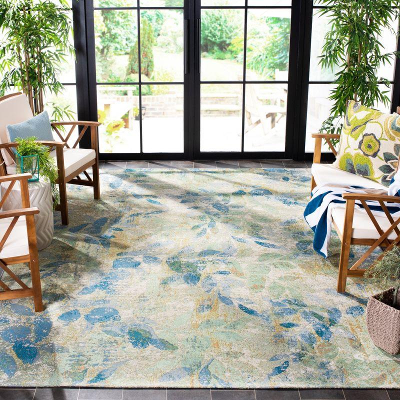 Reversible Tropical Oasis Blue/Ivory Synthetic Area Rug 8' x 10'