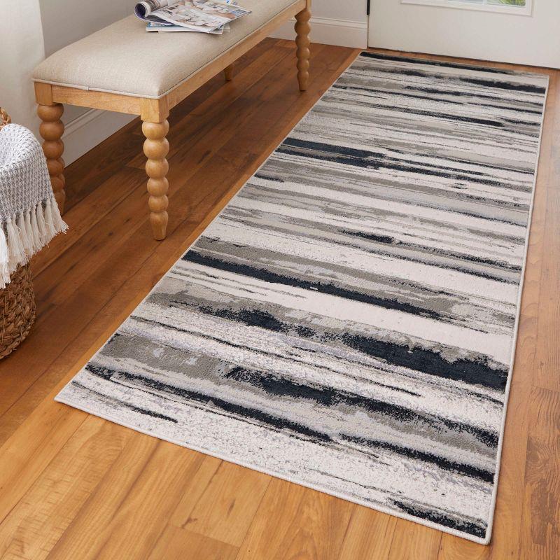 Micah Modern Abstract Black 34" Synthetic Area Rug