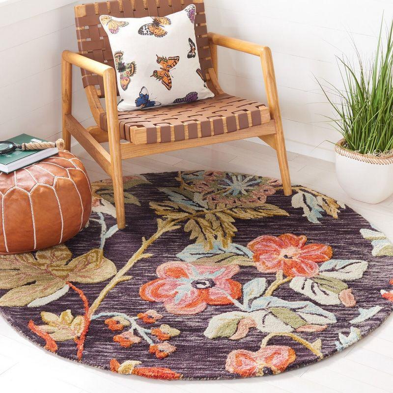 Handmade Round Floral Blue and Orange Wool Area Rug