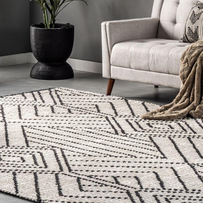 Luxurious Beige Synthetic 6'7" x 9' Shag Area Rug with Modern Diamond Fringe