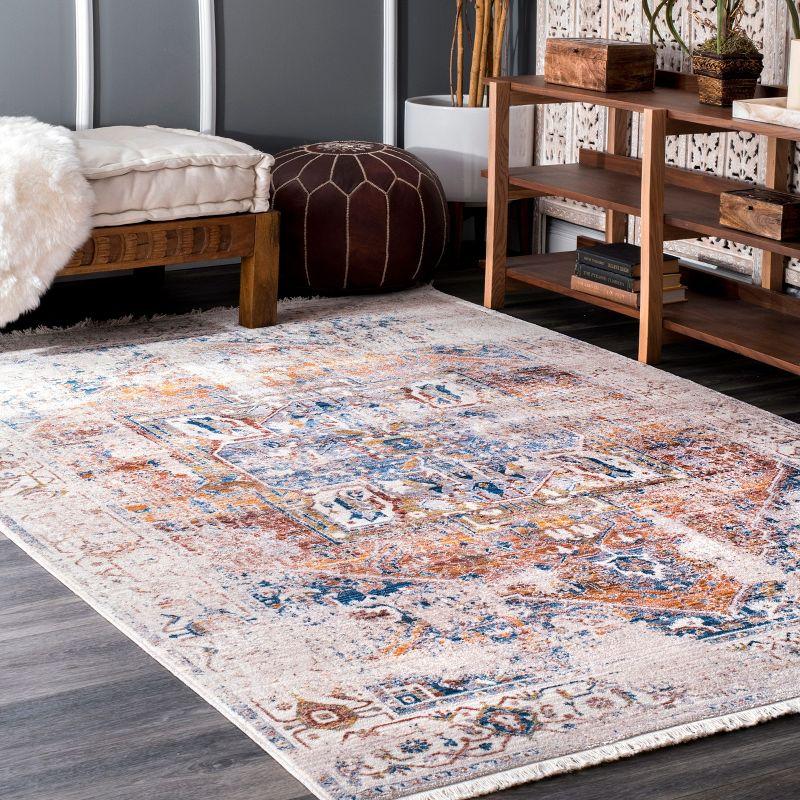 Ivory and Blue Medallion 8' x 10' Synthetic Area Rug