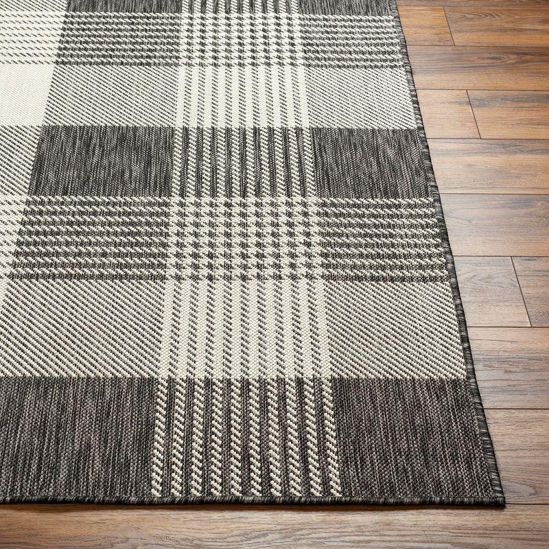 Jarad Black and Cream 5'3" x 7' Woven Indoor/Outdoor Area Rug