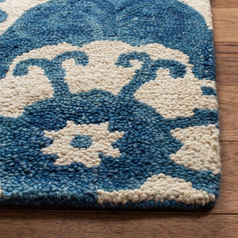 Handmade Blue and Ivory Wool Tufted 6' x 9' Rug