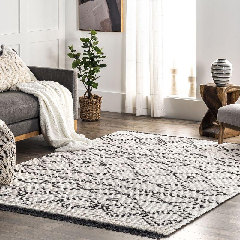 Beige and Ivory 4' x 6' Shag Area Rug with Fringe