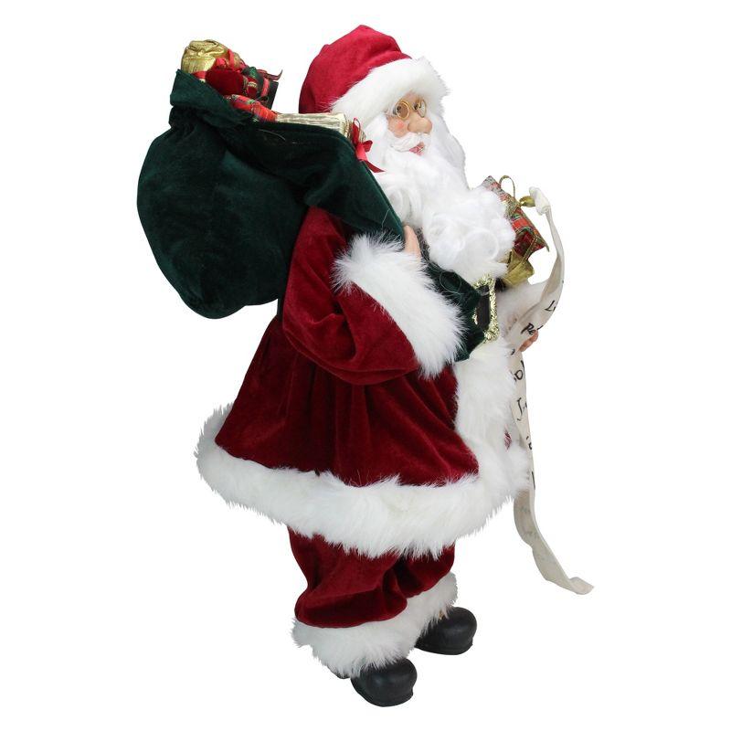 Northlight 24" Santa Claus with Bag of Gifts and Naughty or Nice List Christmas Figure
