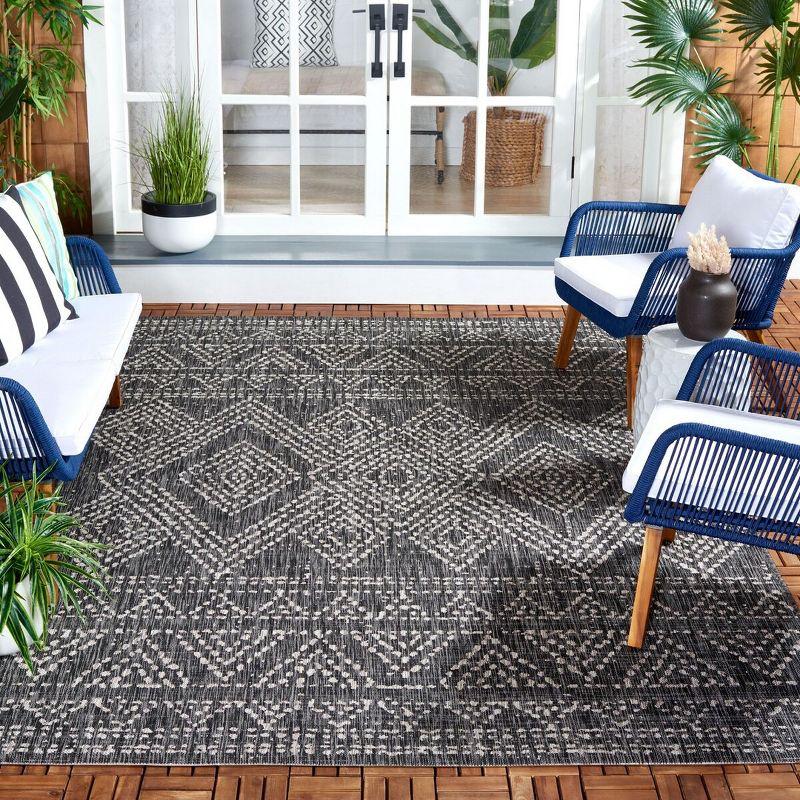 Black and Beige Geometric Rectangular Synthetic Area Rug