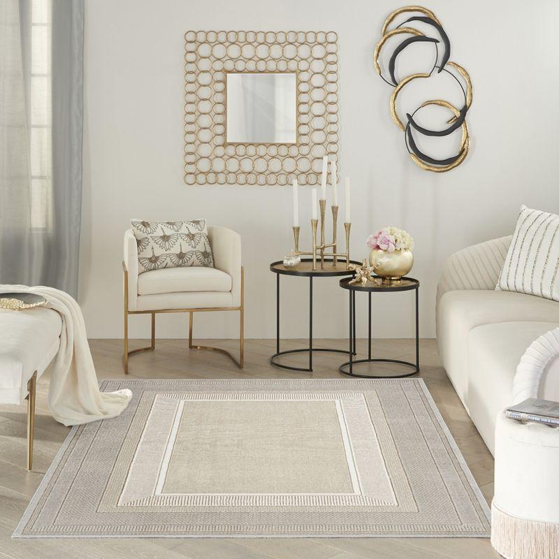 Ivory Geometric Abstract 5' x 7' Easy-Care Synthetic Area Rug