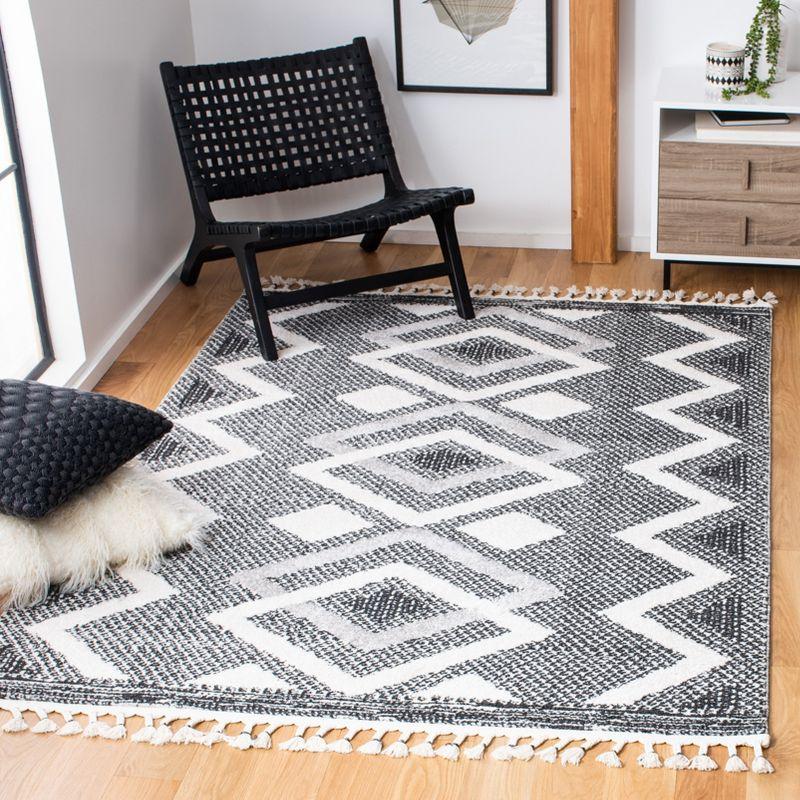 Ivory and Black Diamond Pattern Shag Area Rug with Braided Fringe