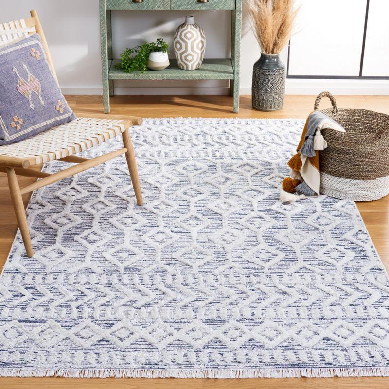 Ivory and Blue Nomadic Pattern 5' x 7' Synthetic Area Rug