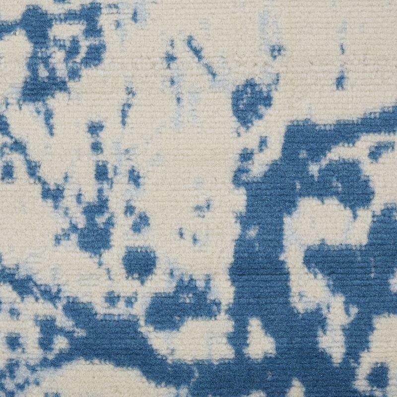 Ivory and Blue Abstract Synthetic 2' x 4' Easy-Care Area Rug